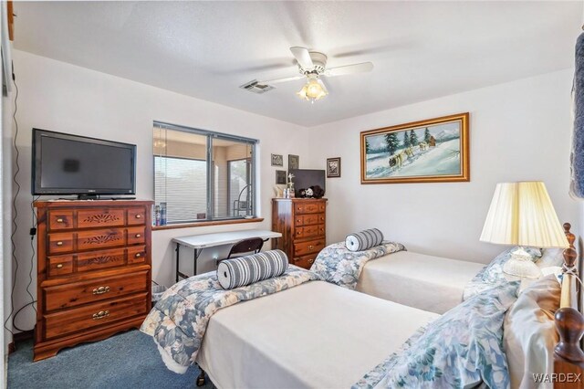 bedroom featuring a ceiling fan, carpet, and visible vents