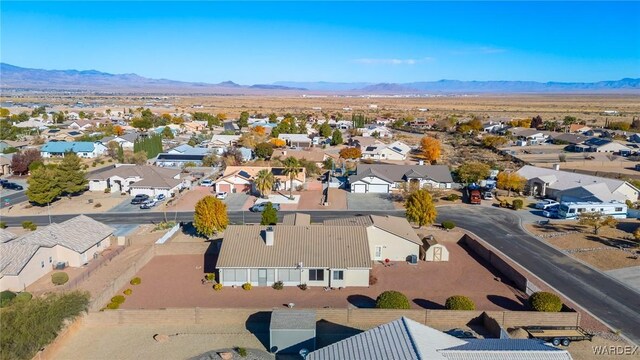 birds eye view of property featuring a mountain view and a residential view