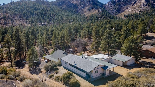 bird's eye view with a mountain view and a view of trees