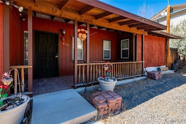 doorway to property featuring covered porch