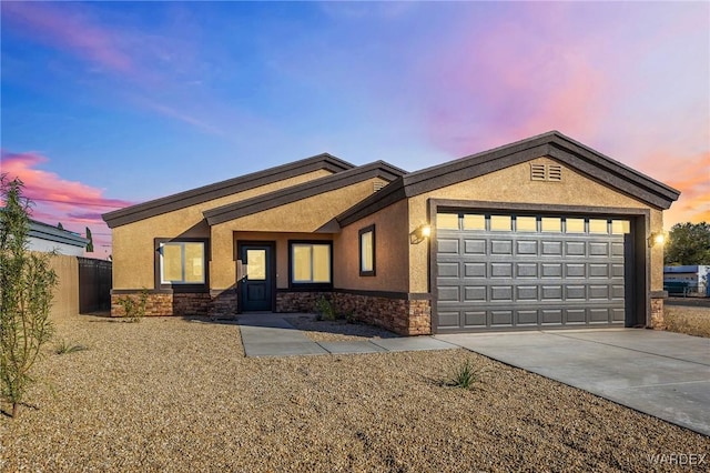 ranch-style house featuring stucco siding, an attached garage, fence, stone siding, and driveway