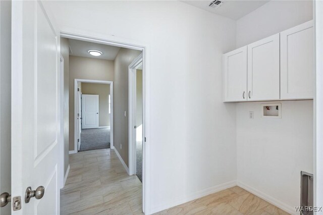 laundry room featuring cabinet space, hookup for a washing machine, visible vents, and baseboards