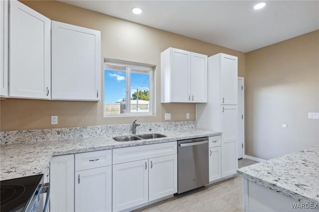 kitchen with electric range, white cabinets, dishwasher, light stone countertops, and a sink