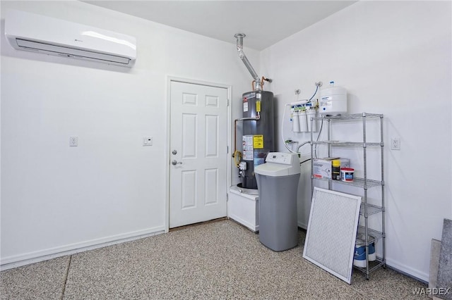 washroom with water heater, a wall unit AC, and baseboards