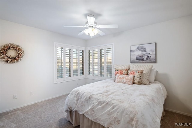 bedroom featuring ceiling fan, carpet, and baseboards