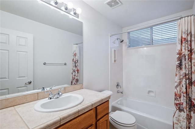 full bath with shower / bath combination with curtain, visible vents, vanity, and toilet