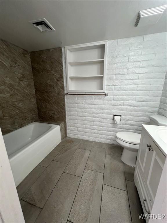 full bathroom with toilet, visible vents, and vanity