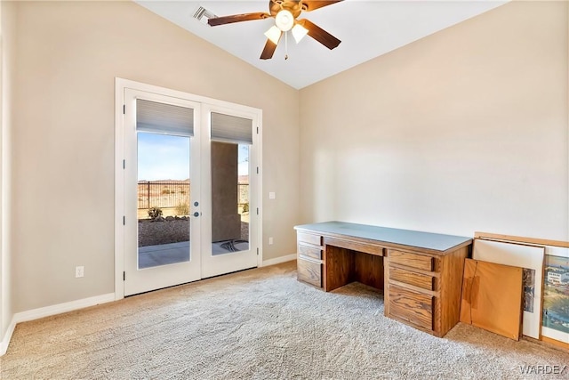 home office featuring lofted ceiling, baseboards, light carpet, and visible vents