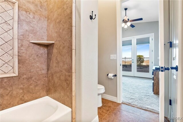 full bath with ceiling fan, tile patterned flooring, toilet,  shower combination, and french doors