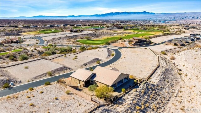 bird's eye view featuring view of golf course and a mountain view