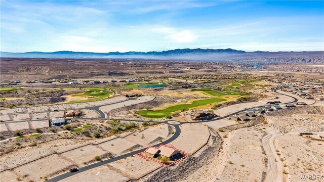 birds eye view of property featuring view of golf course and a mountain view