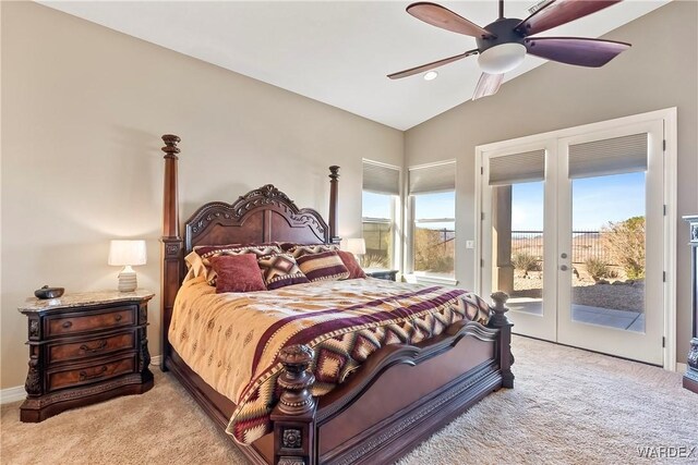 bedroom with light carpet, access to outside, multiple windows, and vaulted ceiling