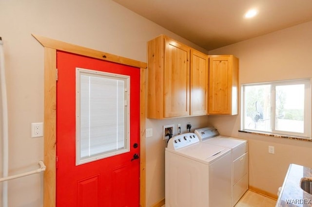 laundry area featuring independent washer and dryer and cabinet space