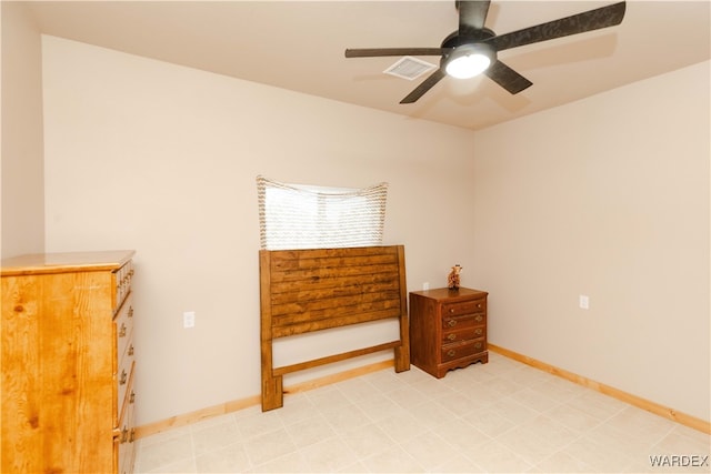 bedroom featuring ceiling fan, visible vents, and baseboards