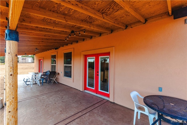 view of patio featuring outdoor dining space and french doors