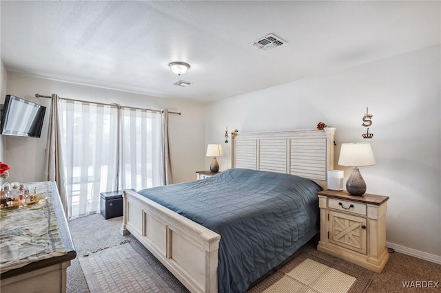 bedroom with light carpet, visible vents, and baseboards