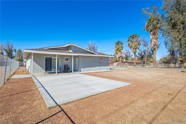 single story home featuring a patio, fence, and stucco siding