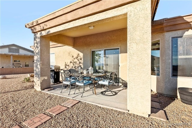 view of patio / terrace with a grill and outdoor dining area