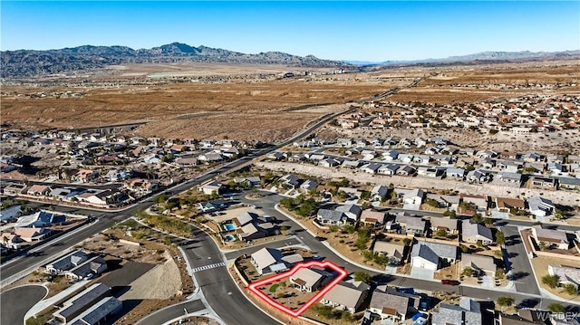 drone / aerial view featuring a residential view and a mountain view