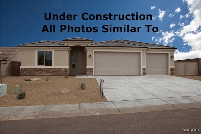 view of front of property with a garage, stone siding, concrete driveway, and stucco siding