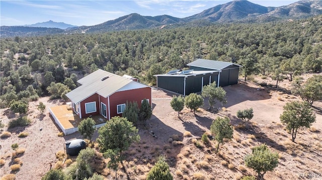 bird's eye view featuring a mountain view and a wooded view