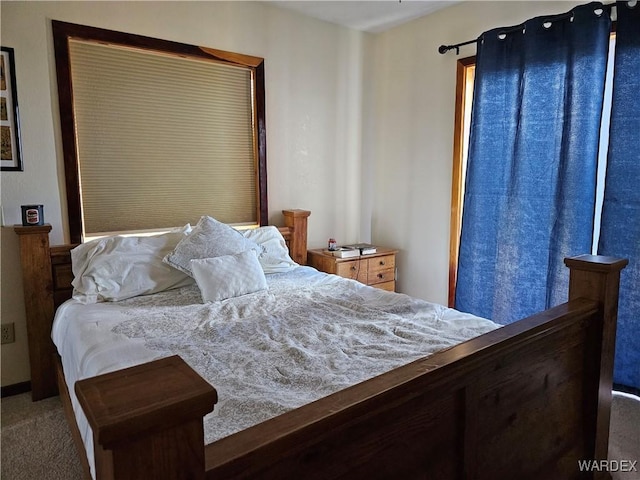 bedroom with dark carpet
