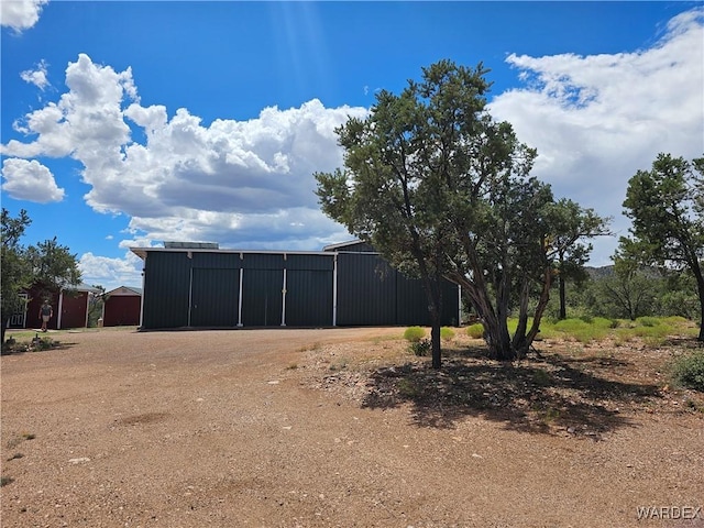 exterior space featuring an outbuilding