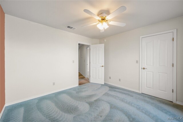 bedroom featuring a ceiling fan, carpet, visible vents, and baseboards