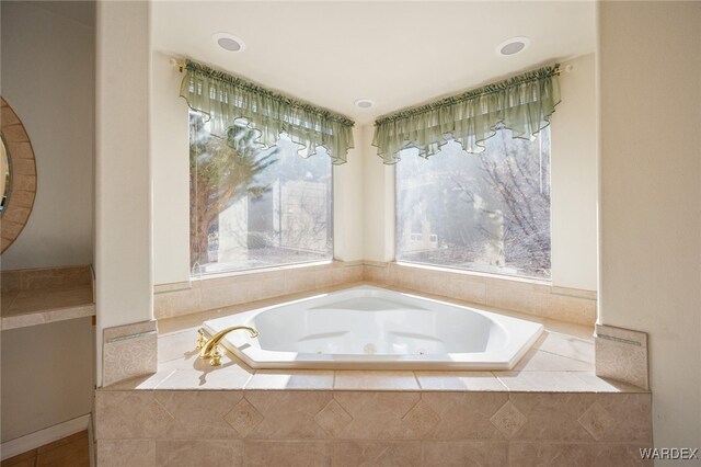 bathroom featuring a tub with jets