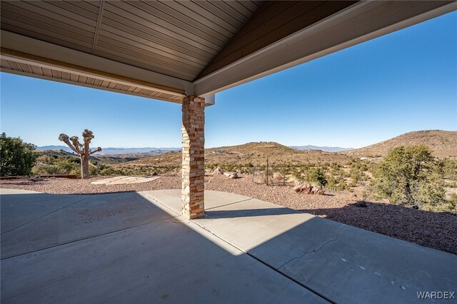 view of patio / terrace featuring a mountain view