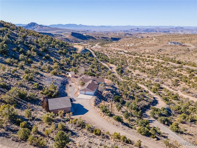 birds eye view of property featuring a mountain view