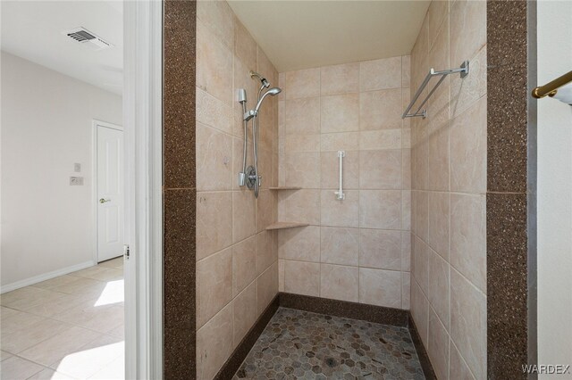 bathroom featuring a stall shower and visible vents