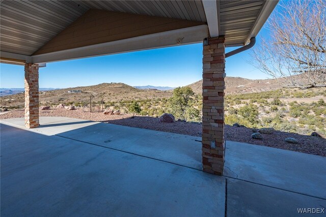 view of patio / terrace featuring a mountain view