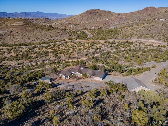 birds eye view of property featuring a mountain view