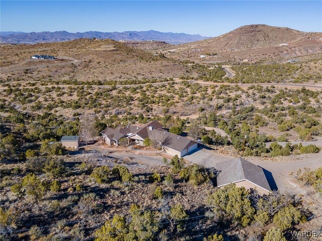 birds eye view of property with a mountain view