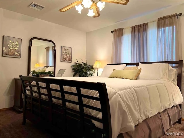 bedroom featuring ceiling fan and visible vents