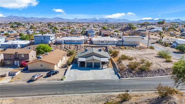 birds eye view of property with a residential view and a mountain view