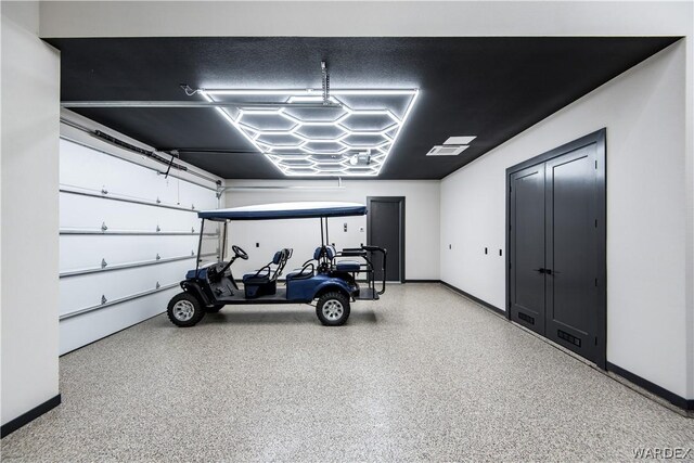 garage with baseboards