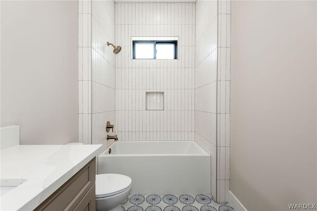 bathroom with toilet, bathing tub / shower combination, and vanity