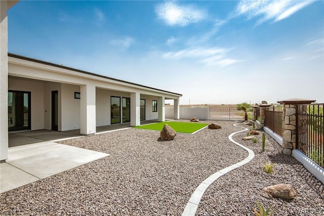 view of yard with a fenced backyard and a patio