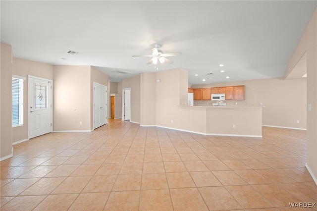 2460 Topanga Dr, Bullhead City, AZ 86442 - unfurnished living room featuring recessed lighting, a ceiling fan, light tile patterned flooring, and baseboards
