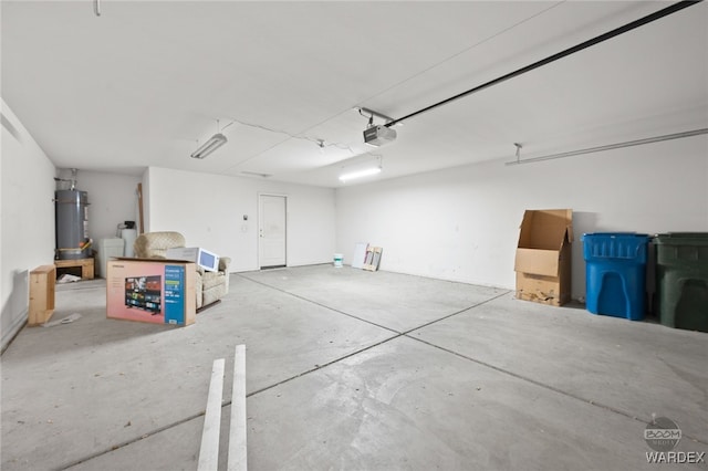 garage featuring a garage door opener and water heater