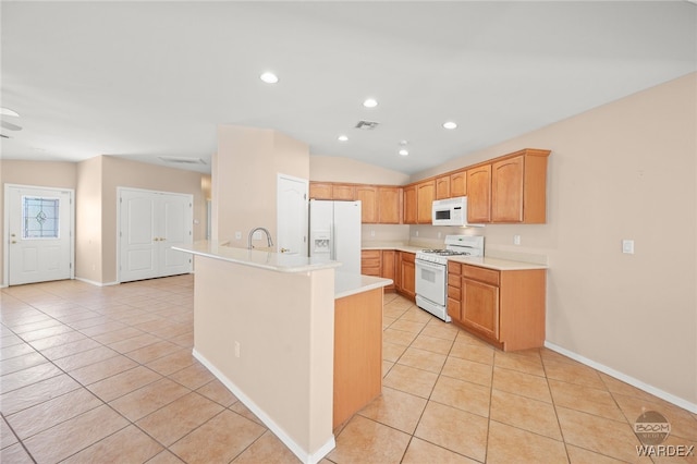 kitchen featuring white appliances, light tile patterned floors, light countertops, a sink, and recessed lighting