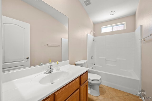 full bath featuring visible vents, toilet, tile patterned flooring, vanity, and washtub / shower combination