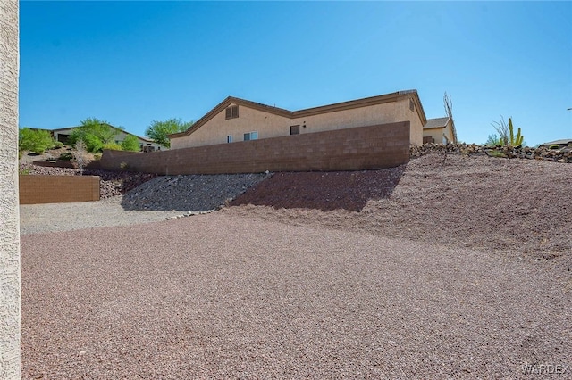 2460 Topanga Dr, Bullhead City, AZ 86442 - view of home's exterior with fence and stucco siding
