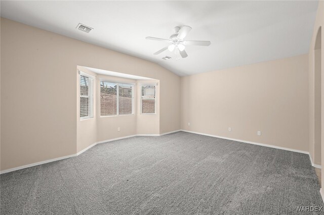 2460 Topanga Dr, Bullhead City, AZ 86442 - empty room with a ceiling fan, carpet floors, baseboards, and vaulted ceiling