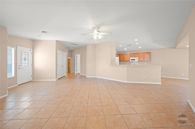 unfurnished living room featuring light tile patterned floors, baseboards, visible vents, ceiling fan, and recessed lighting