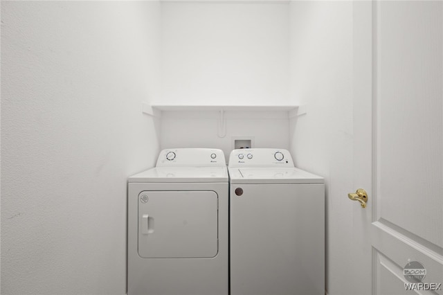 clothes washing area with laundry area and separate washer and dryer