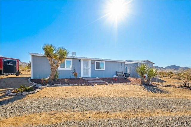 view of front of property with a mountain view