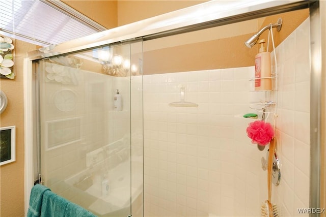 full bathroom featuring a stall shower